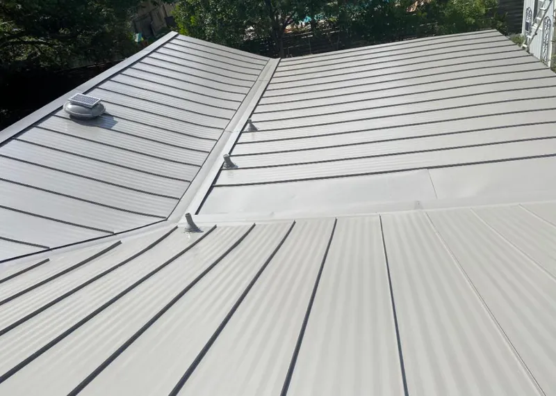 Solar attic fan installed on a metal roof for Roof Ventilation in Frederickson